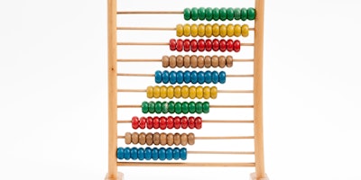 A multicolored wooden abacus against a white background