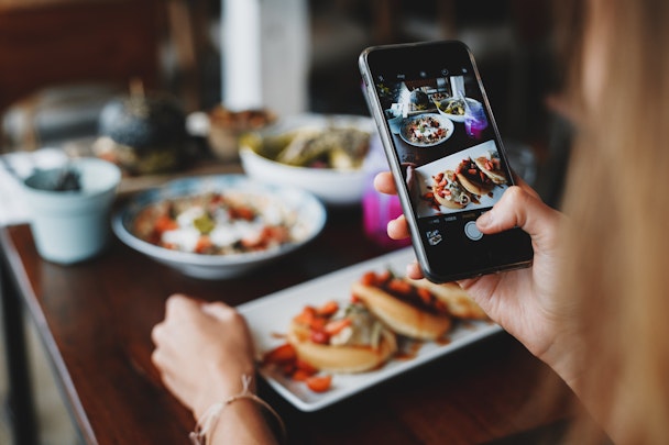 Someone taking a picture of food