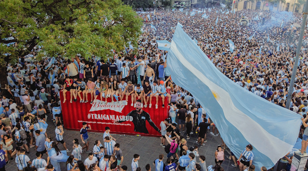 Argentina fans celebrate next to a shipping container full of Bud