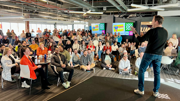 VML CEO Jon Cook on stage in front of VML employees in the NYC office