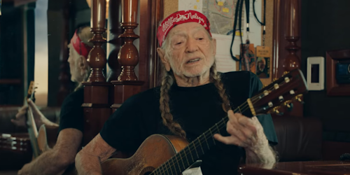 willie nelson with a guitar